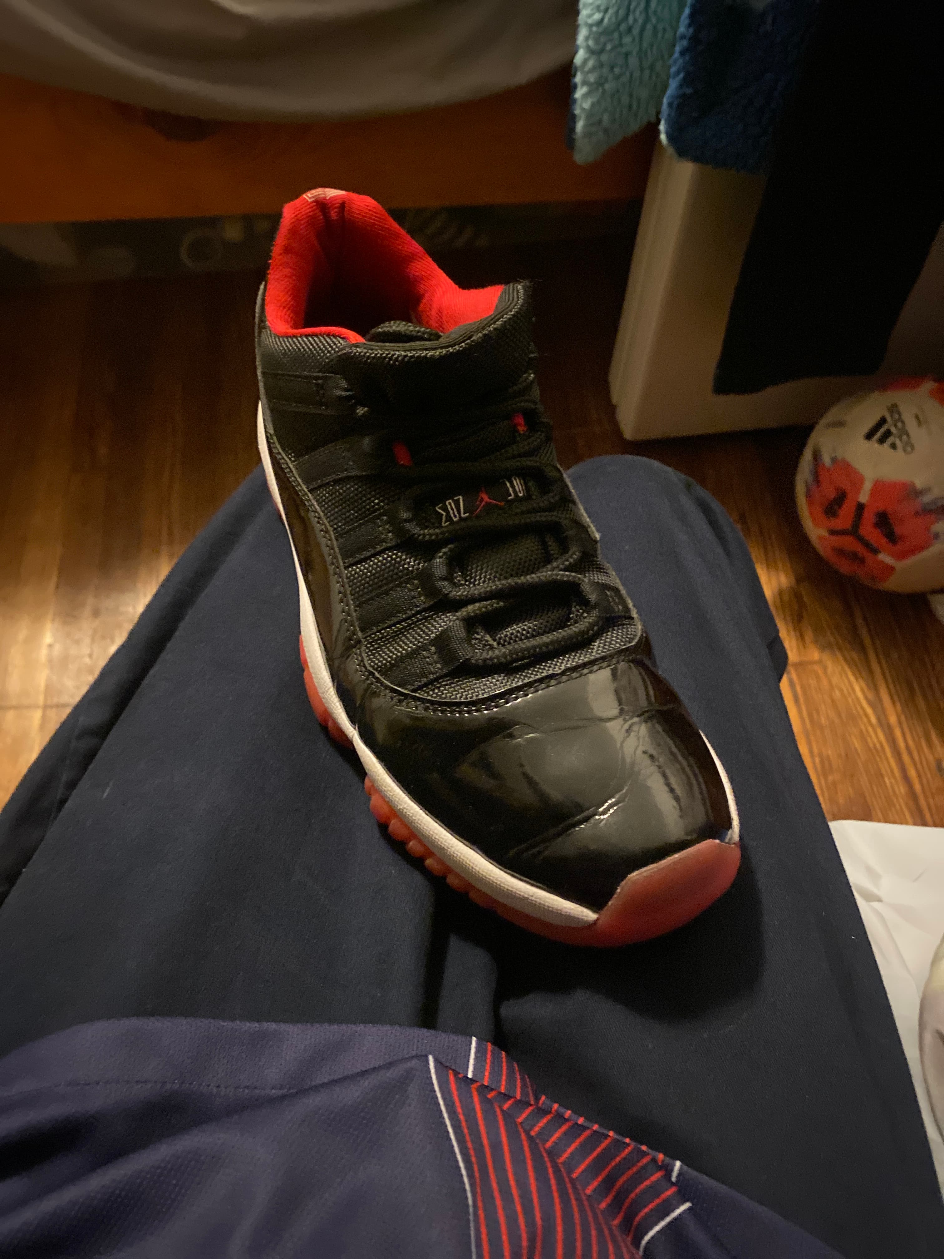 Air Jordan 11 Retro Low 'Bred' (Black/Red) - AI says Real - Image 1