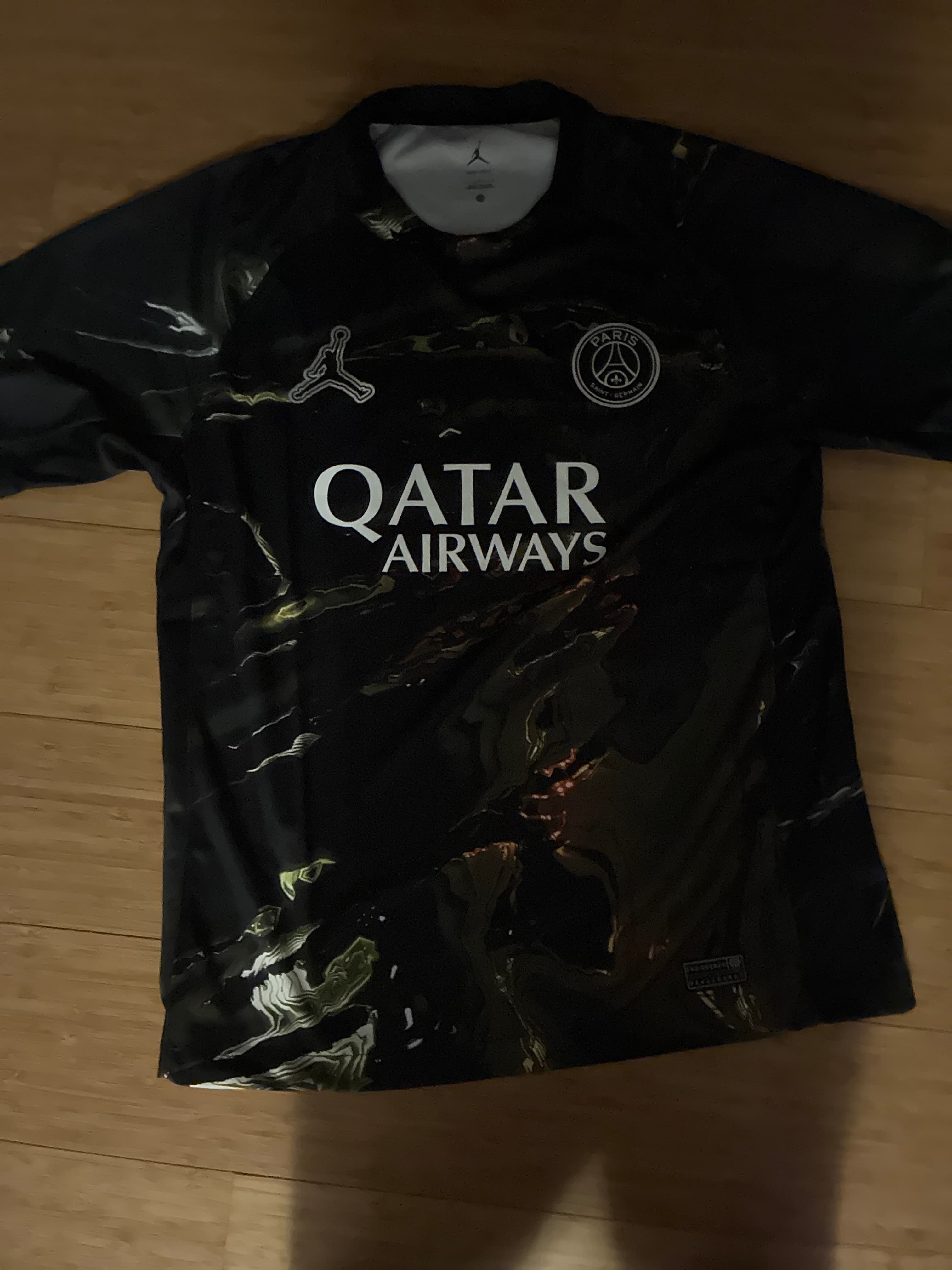 Paris Saint-Germain (PSG) x Jordan Brand Fourth/Special Edition Football Jersey - Black Marble/Gold - AI says Fake - Image 1