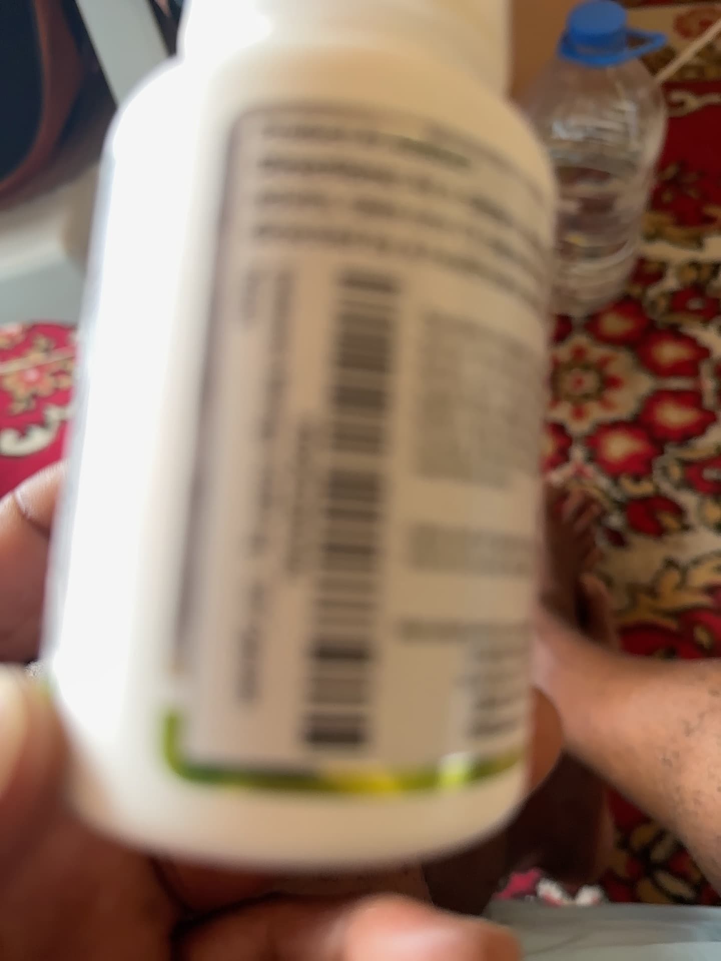 Dietary Supplement Bottle (likely Nature Made or similar brand - unidentifiable due to image blur) - AI says Real - Image 1