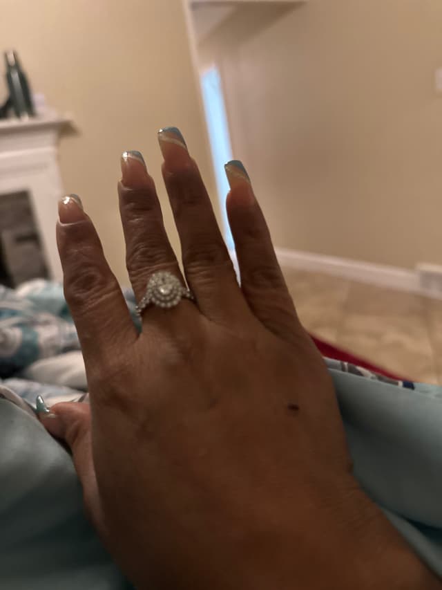 Diamond halo engagement ring - AI says Real