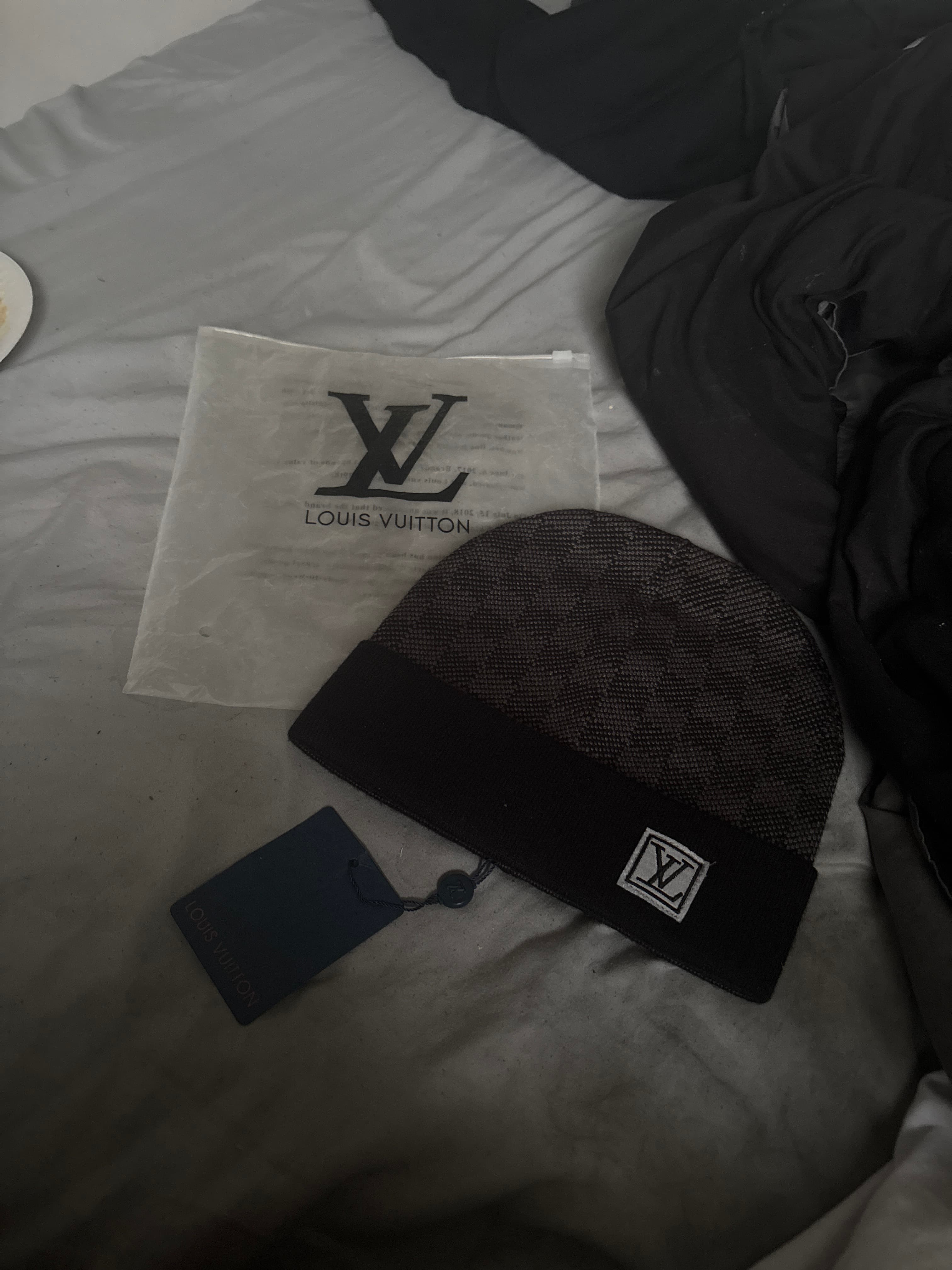 Louis Vuitton grey-and-black knit beanie with LV Initials patch - AI says Fake - Image 1